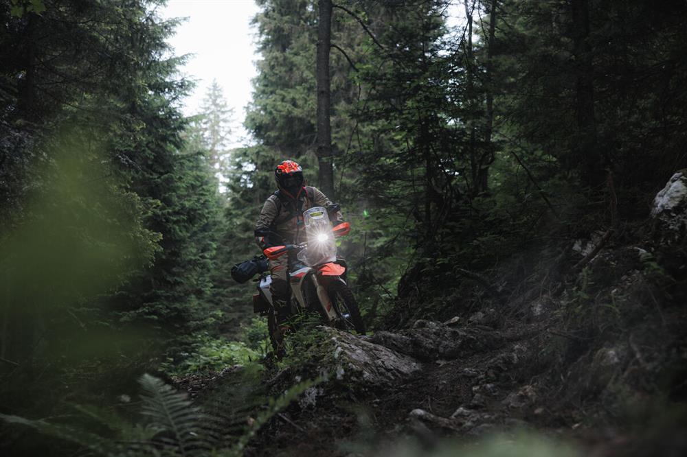 KTM Rally 690 riding through a forest